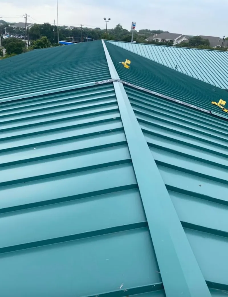 Green commercial metal roof ridge and valley for Metal Roof Repair in Douglass Hills